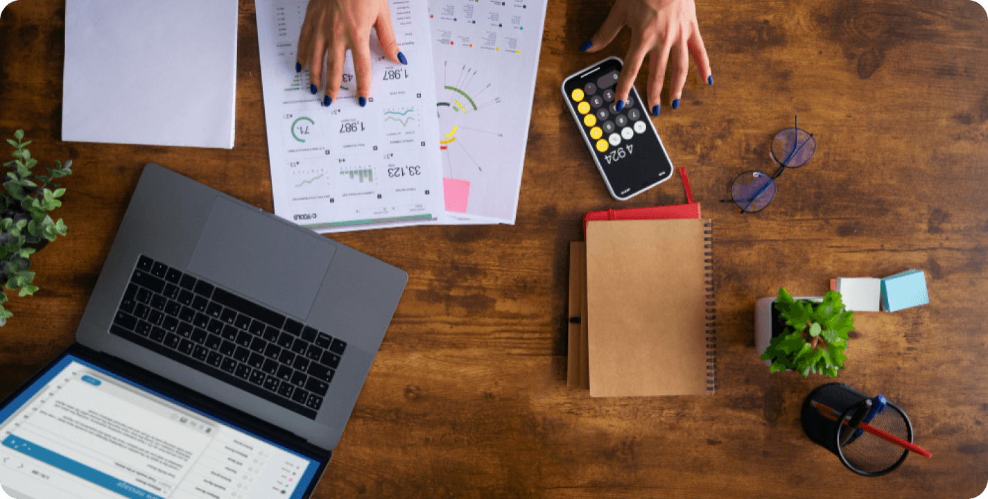 Smart budgeting workspace with laptop and planning materials