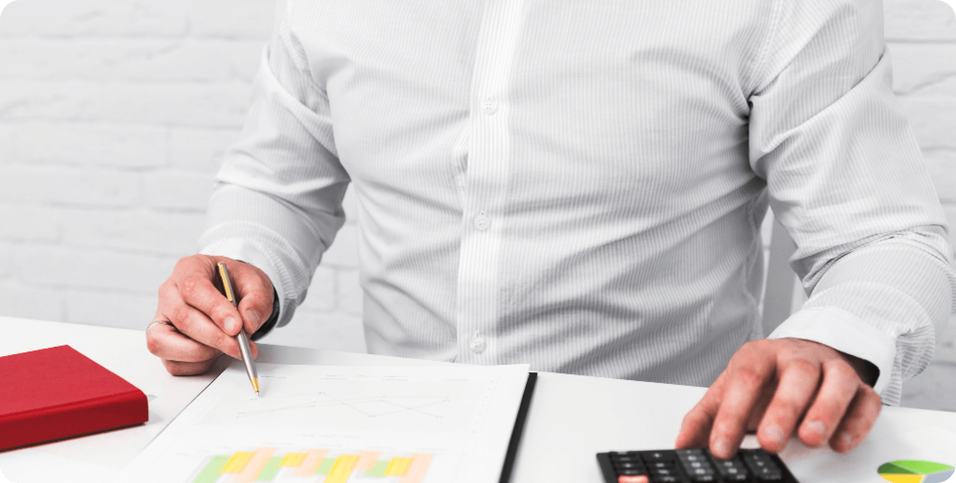 Person reviewing expenses with calculator